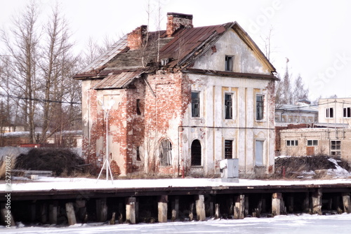 An abandoned stone house on the Quay in winter