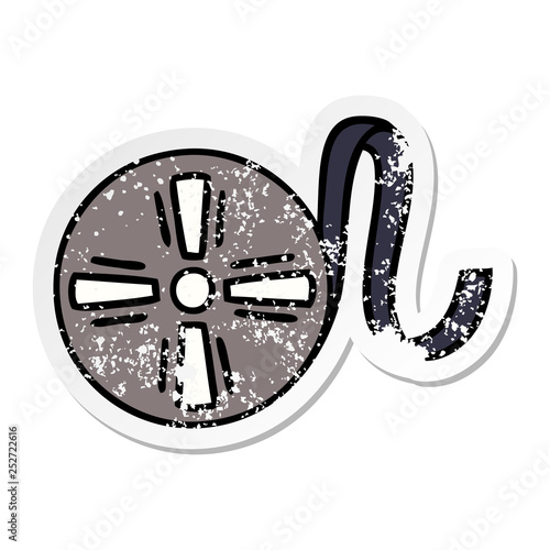 distressed sticker of a cute cartoon movie tape