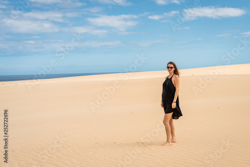 young girl walking on desert sands