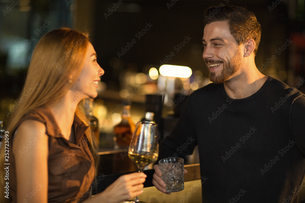Young couple enjoying romantic date at the bar Young couple enjoying romantic date at the bar