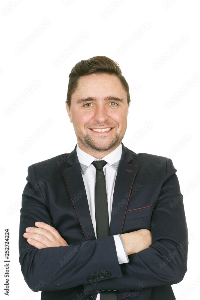 Smile of success. Half length studio portrait of a confident businessman smiling to the camera with his arms crossed Smile of success. Half length studio portrait of a confident businessman smiling to the camera with his arms crossed