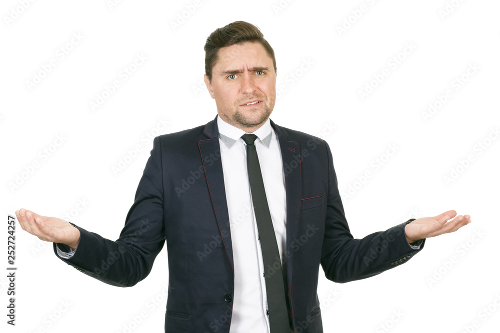 Confused. Studio shot of a confused businessman spreading his hands Confused. Studio shot of a confused businessman spreading his hands