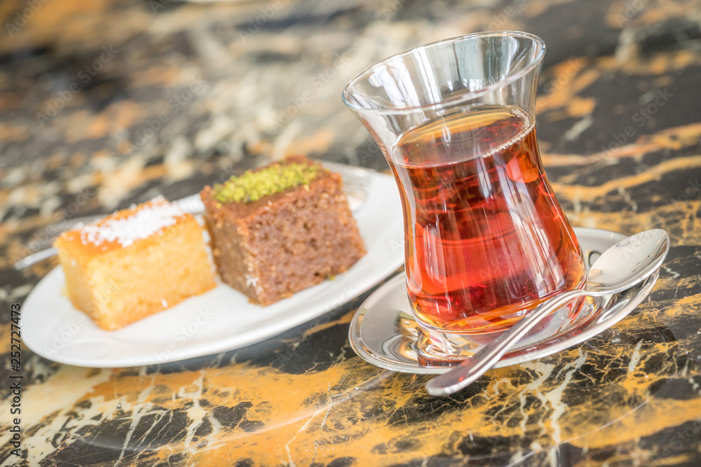traditional Turkish red black tea tulip glass green flowers sweet dessert afternoon tea break