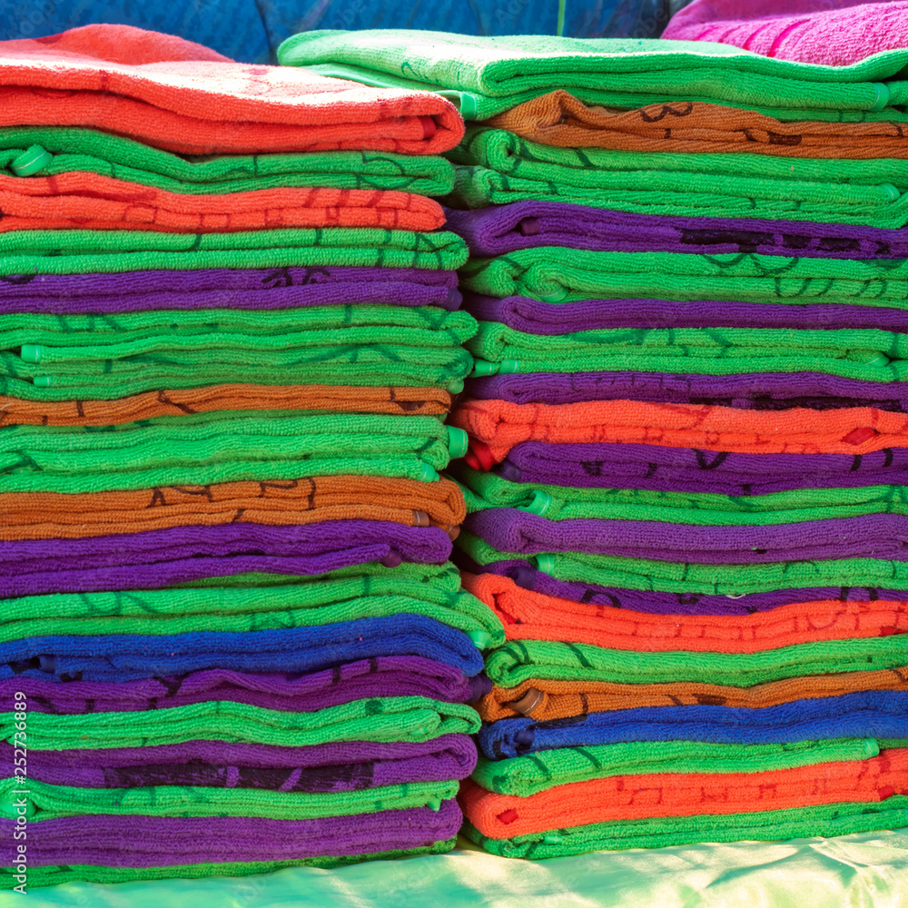 Many colorful towels folded. Many colorful towels folded.
