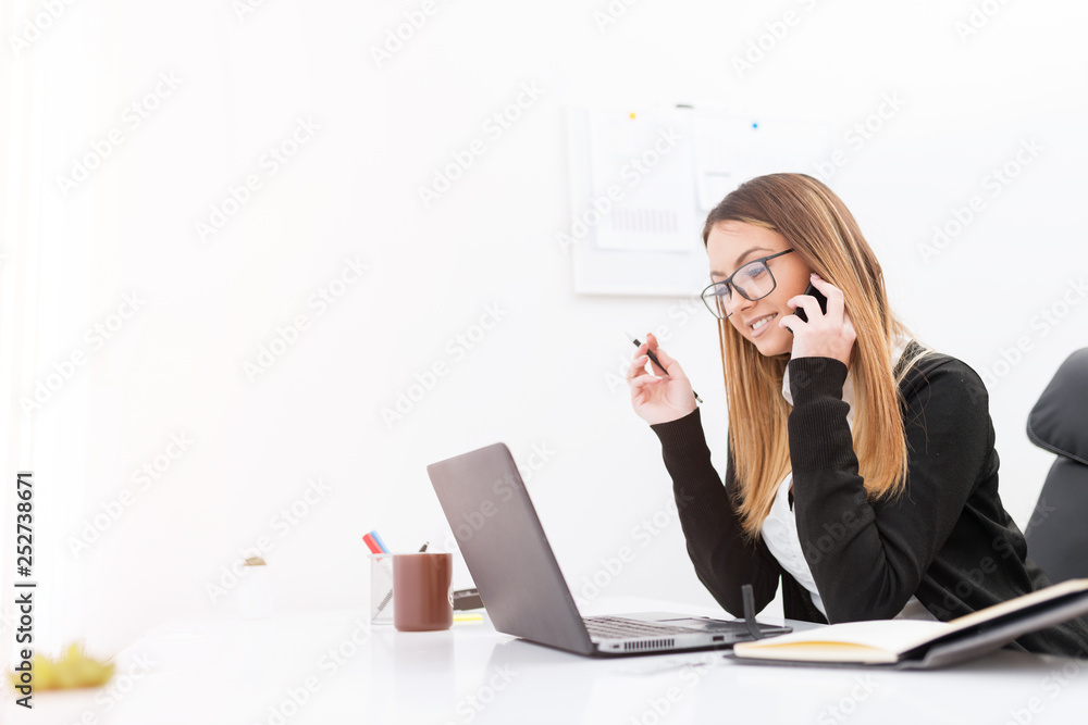 Beautiful young woman working in the office. Beautiful young woman working in the office.