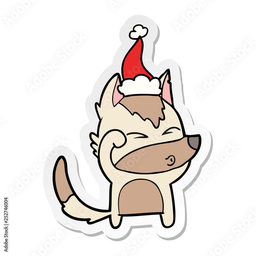 sticker cartoon of a wolf pouting wearing santa hat