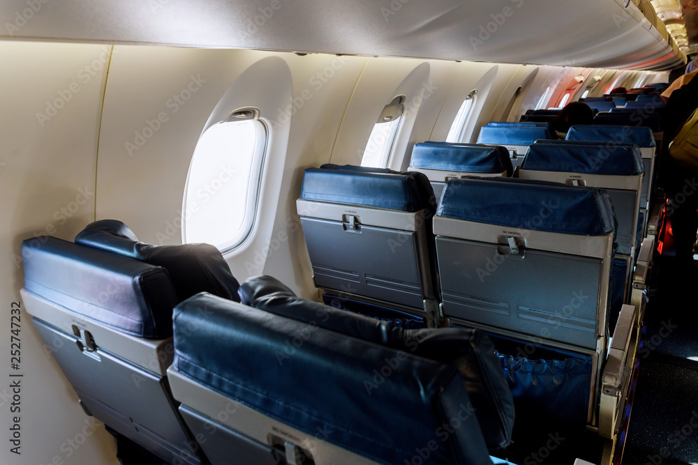 Left armchairs in a built-in chairs Aircraft Cabin Economy class