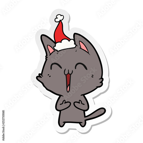 happy sticker cartoon of a cat wearing santa hat