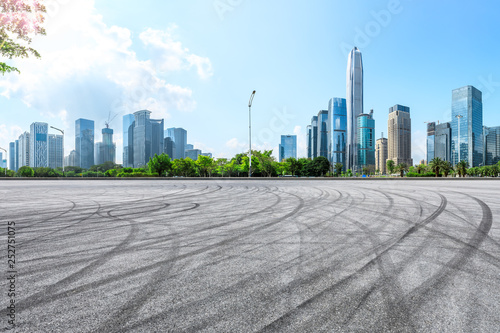 Empty asphalt square ground and city skyline with buildings in Shenzhen