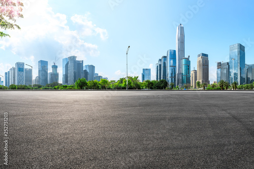 Empty asphalt square ground and city skyline with buildings in Shenzhen