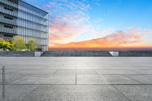 Wallpaper Mural Empty square floor and modern city skyline with buildings at sunset Torontodigital.ca
