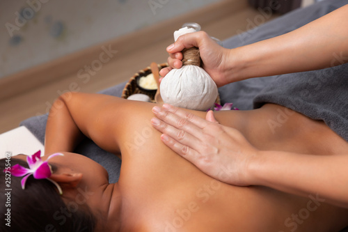 Wallpaper Mural Asian woman enjoying a salt scrub massage at spa. Torontodigital.ca