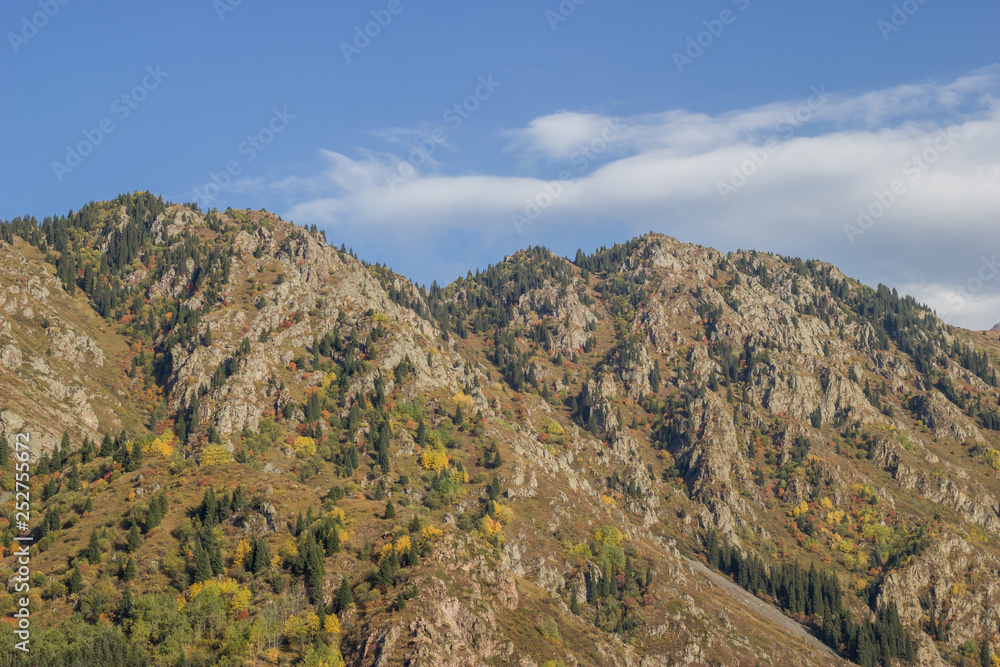 Rocky mountains and blue cloudy sky Rocky mountains and blue cloudy sky