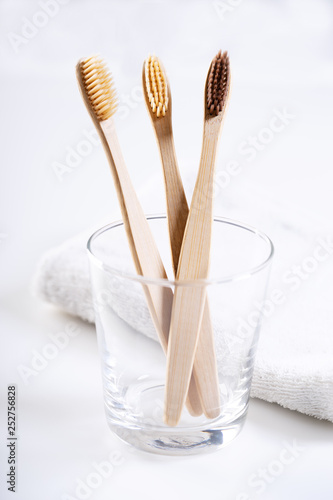 bamboo toothbrushes in glass