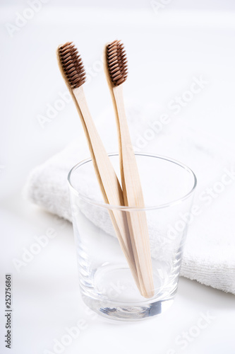 bamboo toothbrushes in glass