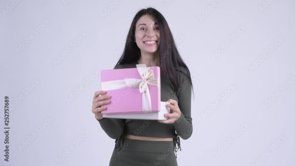 Happy young beautiful woman opening gift box and looking surprised Happy young beautiful woman opening gift box and looking surprised
