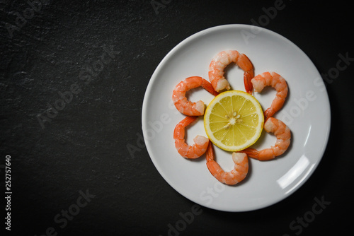 Seafood plate fresh shrimps prawns decorate dinner table with lemon in the seafood restaurant