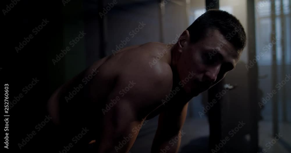 CU Portrait of handsome Caucasian white male athlete catching breath during workout in functional gym. 4K UHD CU Portrait of handsome Caucasian white male athlete catching breath during workout in functional gym. 4K UHD