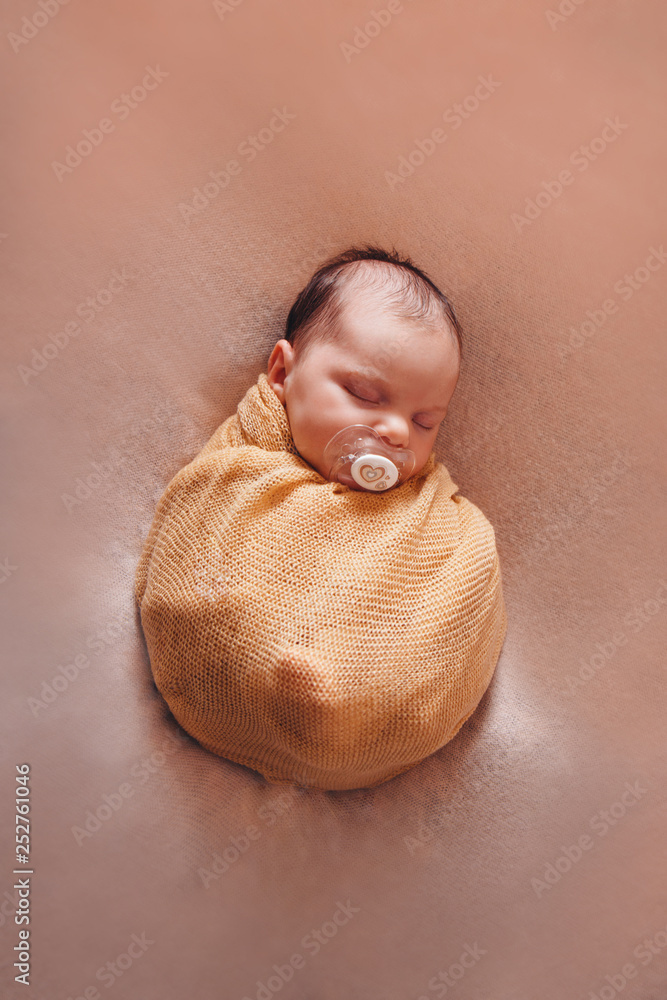 Newborn baby wrapped in blanket outlet