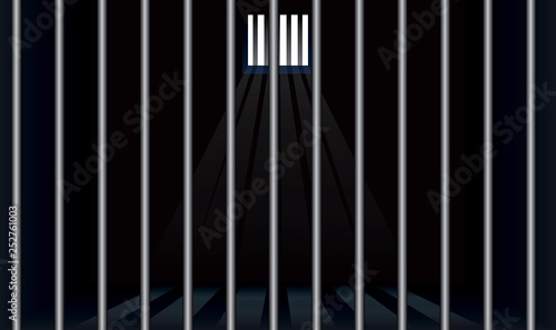 Prison cell with bars in foreground