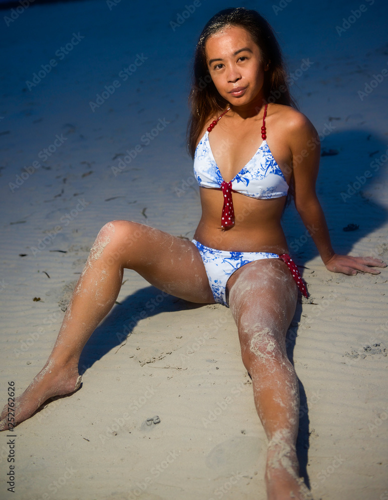 Young Filipino girl at beach in bikini Stock Photo | Adobe Stock