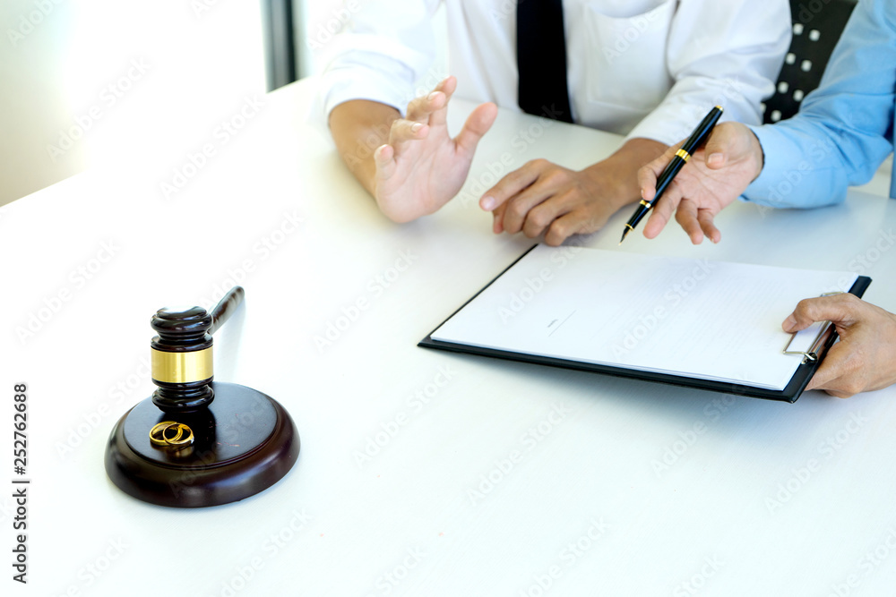 woman and man quarrel in front of gavel woman and man quarrel in front of gavel