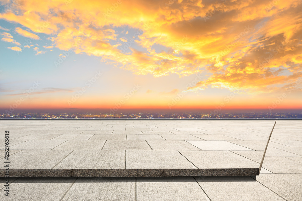 Empty square floor and modern city skyline with beautiful colorful clouds at sunset