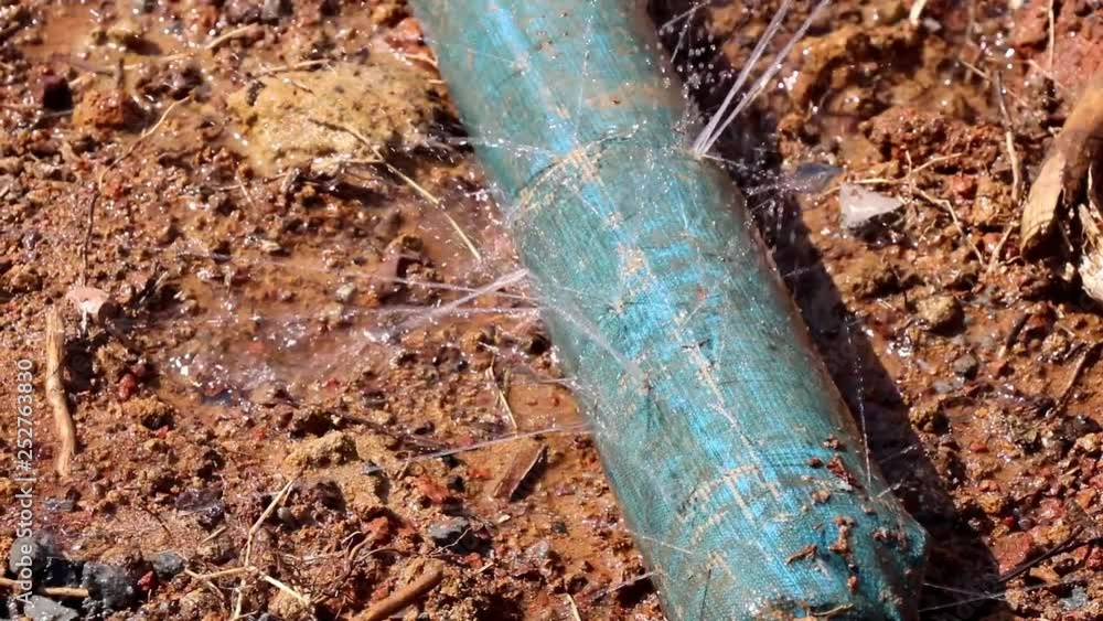 water leaking from hole in a hose, Water pipe break, leaking from hole