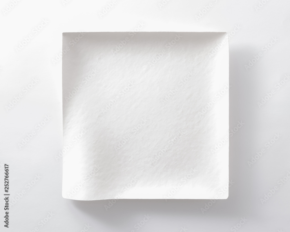 a square plate made of paper with curved lines. unique dish. a square plate made of paper with curved lines. unique dish.