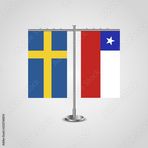 Table stand with flags of Sweden and Chile.Two flag. Flag pole. Symbolizing the cooperation between the two countries. Table flags