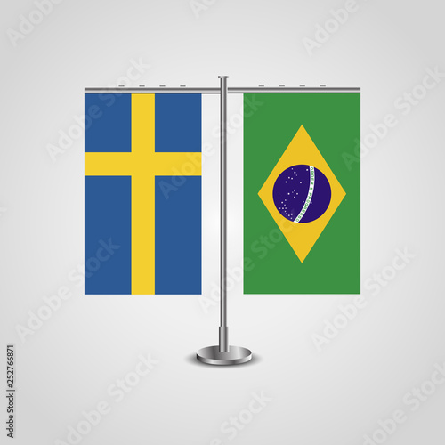 Table stand with flags of Sweden and Brazil.Two flag. Flag pole. Symbolizing the cooperation between the two countries. Table flags