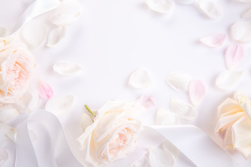 Festive flower composition on the white wooden background. Overhead view