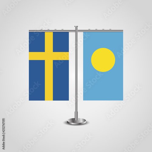 Table stand with flags of Sweden and Palau.Two flag. Flag pole. Symbolizing the cooperation between the two countries. Table flags