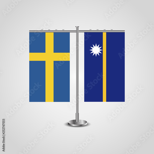 Table stand with flags of Sweden and Nauru.Two flag. Flag pole. Symbolizing the cooperation between the two countries. Table flags