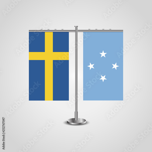 Table stand with flags of Sweden and Micronesia.Two flag. Flag pole. Symbolizing the cooperation between the two countries. Table flags