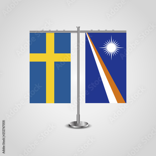Table stand with flags of Sweden and Marshall Islands.Two flag. Flag pole. Symbolizing the cooperation between the two countries. Table flags