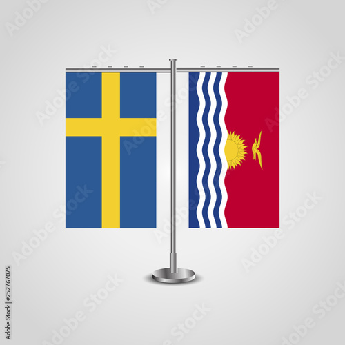 Table stand with flags of Sweden and Kiribati.Two flag. Flag pole. Symbolizing the cooperation between the two countries. Table flags