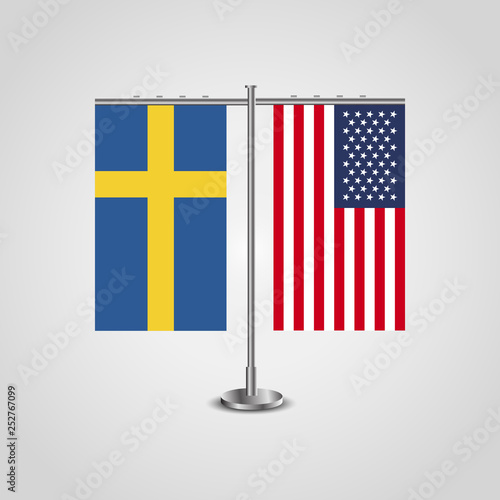 Table stand with flags of Sweden and USA.Two flag. Flag pole. Symbolizing the cooperation between the two countries. Table flags
