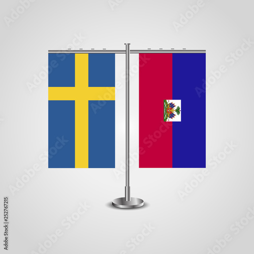 Table stand with flags of Sweden and Haiti.Two flag. Flag pole. Symbolizing the cooperation between the two countries. Table flags