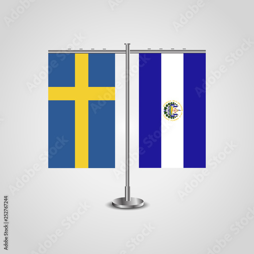 Table stand with flags of Sweden and El Salvador.Two flag. Flag pole. Symbolizing the cooperation between the two countries. Table flags