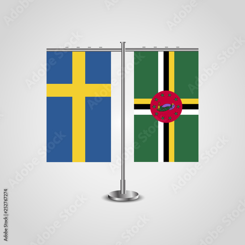 Table stand with flags of Sweden and Dominica.Two flag. Flag pole. Symbolizing the cooperation between the two countries. Table flags