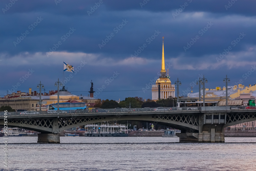 Sunset in Saint Petersburg over the Neva river with the view of Blagoveshchenskiy Bridge and the Admiralty or Admiralteystvo spire
