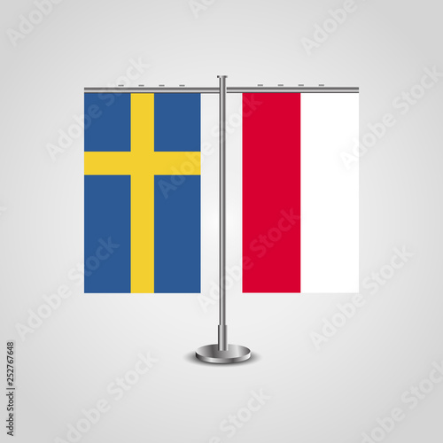 Table stand with flags of Sweden and Poland.Two flag. Flag pole. Symbolizing the cooperation between the two countries. Table flags