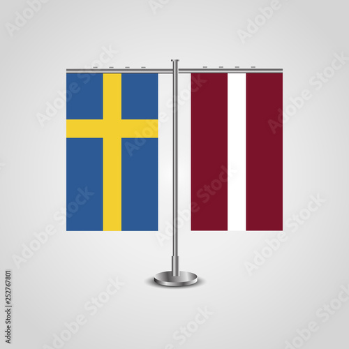 Table stand with flags of Sweden and Latvia.Two flag. Flag pole. Symbolizing the cooperation between the two countries. Table flags