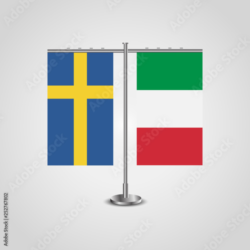 Table stand with flags of Sweden and Italy.Two flag. Flag pole. Symbolizing the cooperation between the two countries. Table flags