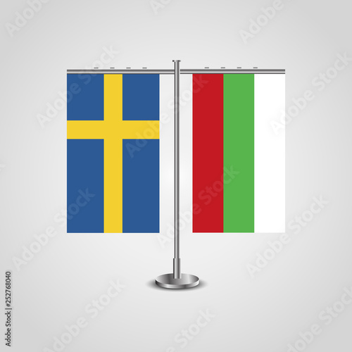 Table stand with flags of Sweden and Bulgaria.Two flag. Flag pole. Symbolizing the cooperation between the two countries. Table flags