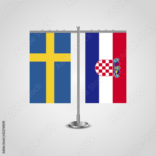 Table stand with flags of Sweden and Croatia.Two flag. Flag pole. Symbolizing the cooperation between the two countries. Table flags