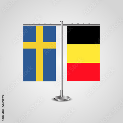 Table stand with flags of Sweden and Belgium.Two flag. Flag pole. Symbolizing the cooperation between the two countries. Table flags