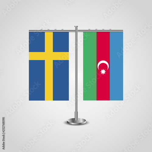 Table stand with flags of Sweden and Azerbaijan.Two flag. Flag pole. Symbolizing the cooperation between the two countries. Table flags