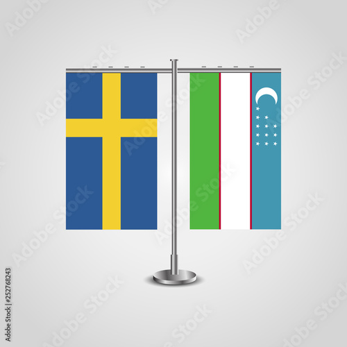 Table stand with flags of Sweden and Uzbekistan.Two flag. Flag pole. Symbolizing the cooperation between the two countries. Table flags